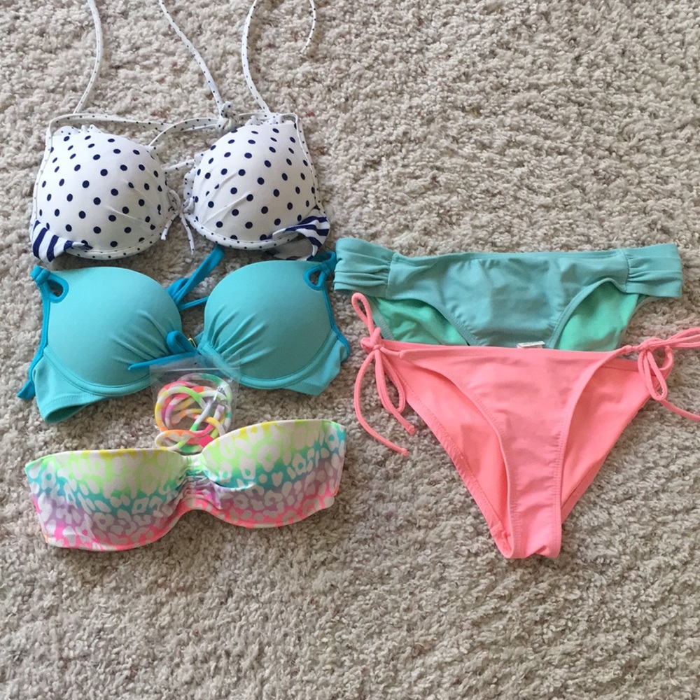 Three bathing suit tops and two bottoms